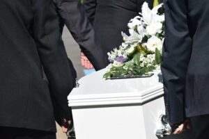 Casket being carried at funeral, wrongful death
