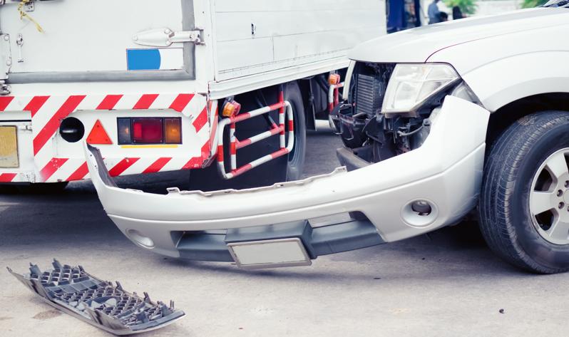The aftermath of a commercial truck accident with a car concept of Charlotte truck accident lawyer