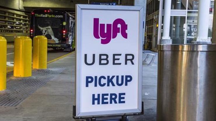 A sign indicating a rideshare pickup location.