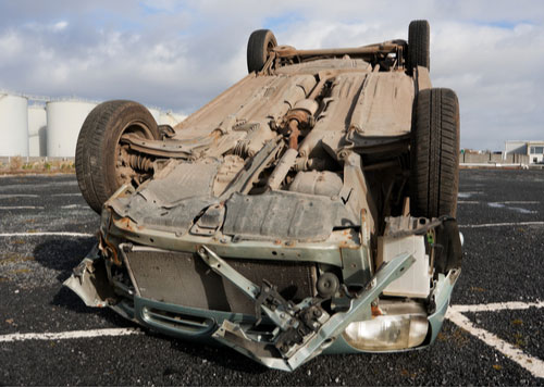 Car flipped upside down after collision