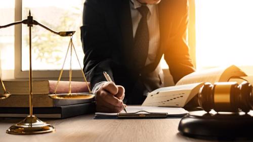 An Atlanta hit and run lawyer filing a claim for a client.