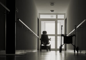 Nursing Home Abuse Lawyer Charlotte, NC - wheelchair in dark nursing home hallway